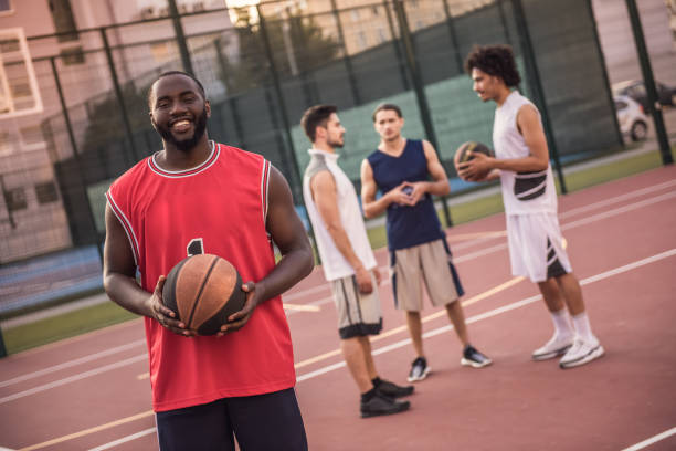 istock Guys playing basketball 860064610
