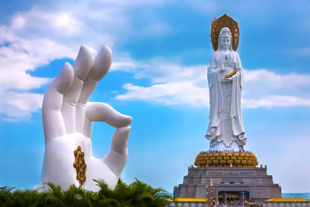 Buddhist goddess and stone hand duplicating the statue OK.