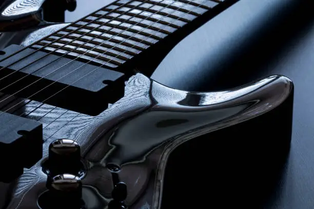 Black electric guitar detail close-up