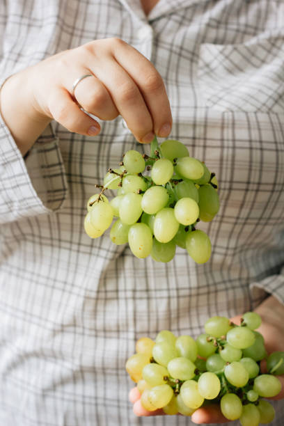 istock Woman holding grape fruits in her hands 860068358