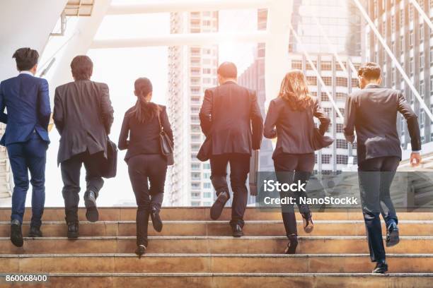 Group Of Business People Running In Row Stock Photo - Download Image Now - Business, Staircase, Teamwork