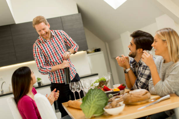 istock Group of young people drinking wine in the room 860073254