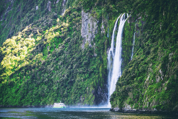 istock Scenic cruise approaches waterfall, Milford Sound. 860075608