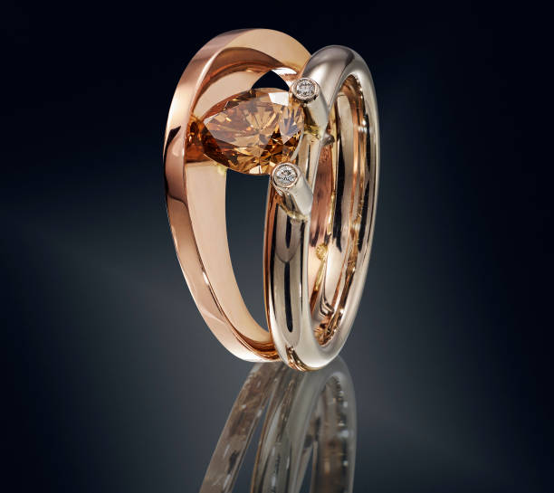 istock Golden ring with gemstone isolated on black background 860075946
