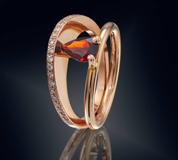 istock Golden ring with gemstone isolated on black background 860076226