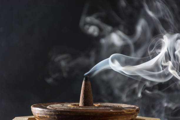 smoke caused by various incenses stock photo