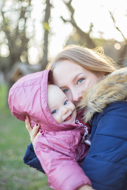 Mother holding babyMother and baby outside