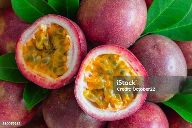 Fresh Passion Fruit On Wood Table In Top View Flat Lay For Background Or Wallpaper Ripe Passion Fruit So Delicious Sweet And Sour Close Up On A Half Of Passion Fruit In Macro Concepttropical Fruit Stock Photo - Download Image Now