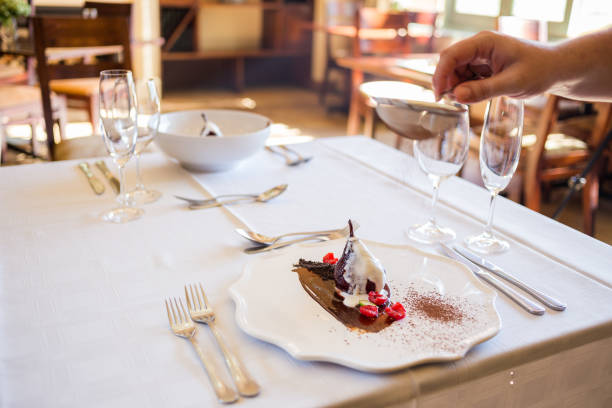 istock Poached pear form gourmet restaurant plated on a chocolate smear. 860080054