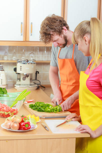 istock Couple preparing fresh vegetables food salad 860081102
