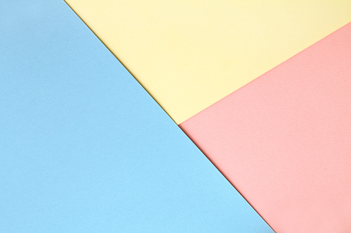 Pastel colored background with multi colored papers