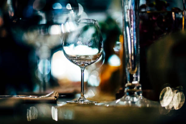 istock Luxury table settings for fine dining with and glassware, beautiful blurred  background. Preparation for holiday  Christmas and Hannukah dinner night. 860081466