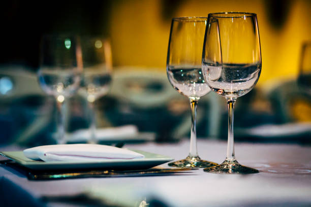 istock Luxury table settings for fine dining with and glassware, beautiful blurred  background. Preparation for holiday  Christmas and Hannukah dinner night. 860081682