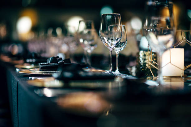 istock Luxury table settings for fine dining with and glassware, beautiful blurred  background. Preparation for holiday  Christmas and Hannukah dinner night. 860081892