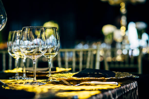 istock Luxury table settings for fine dining with and glassware, beautiful blurred  background. Preparation for holiday  Christmas and Hannukah dinner night. 860084606