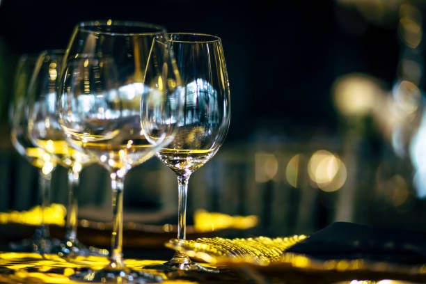 istock Luxury table settings for fine dining with and glassware, beautiful blurred  background. Preparation for holiday  Christmas and Hannukah dinner night. 860084610