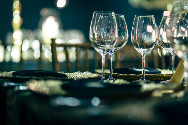 istock Luxury table settings for fine dining with and glassware, beautiful blurred  background. Preparation for holiday  Christmas and Hannukah dinner night. 860084746