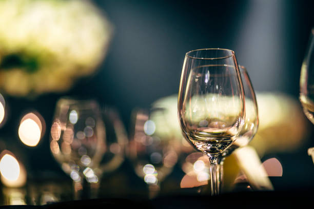 istock Luxury table settings for fine dining with and glassware, beautiful blurred  background. Preparation for holiday  Christmas and Hannukah dinner night. 860085018