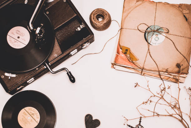 istock Stack of scratched dusty old vinyl records tied with rope on white background 860085302