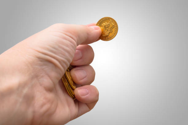 istock Golden coin in hand, 