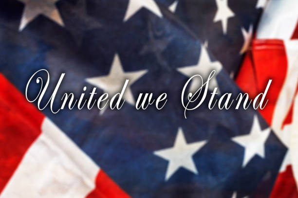 istock United we Stand message on  USA flag. 860085486