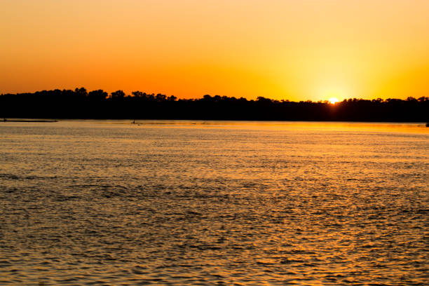 istock golden sunset on a river in the nature 860085656