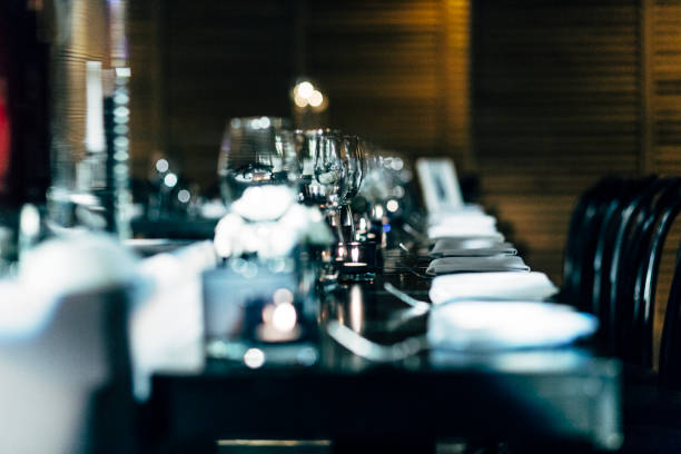 istock Luxury table settings for fine dining with and glassware, beautiful blurred  background. Preparation for holiday  Christmas and Hannukah dinner night. 860087822