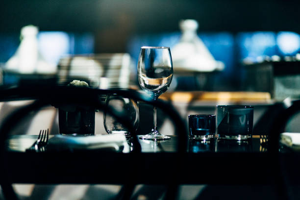 istock Luxury table settings for fine dining with and glassware, beautiful blurred  background. Preparation for holiday  Christmas and Hannukah dinner night. 860088042