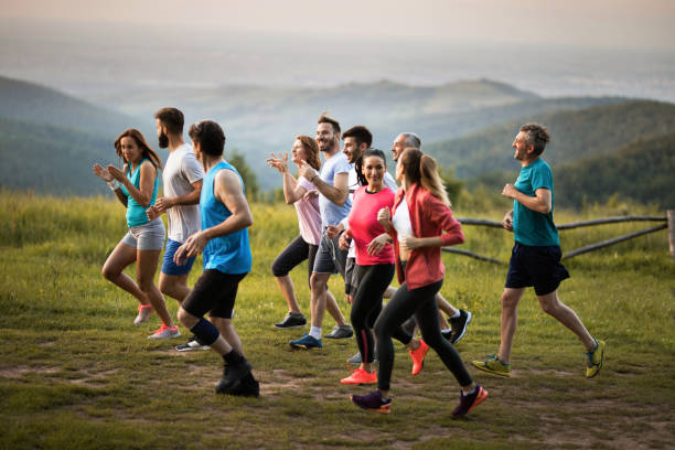 istock Large group of athletes communicating while taking part in cross country running. 860088262