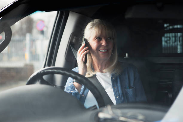 istock Senior On The Phone In Car 860088474