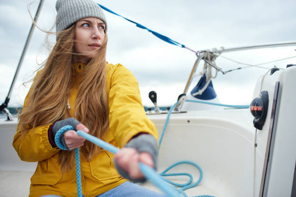 istock Young strong woman sailing the boat 860089078