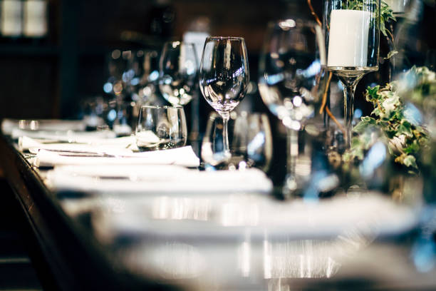 istock Luxury table settings for fine dining with and glassware, beautiful blurred  background. Preparation for holiday  Christmas and Hannukah dinner night. 860089400