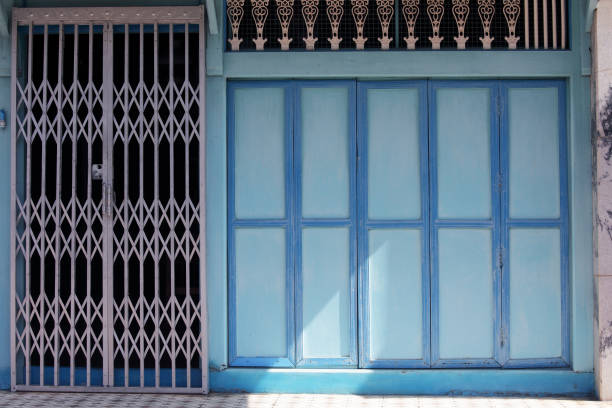 istock vintage folding wooden panel door background. 860089478