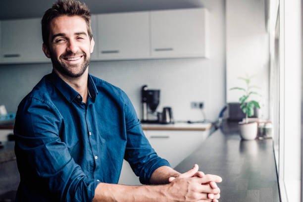 istock Smiling businessman standing with hands clasped 860089886