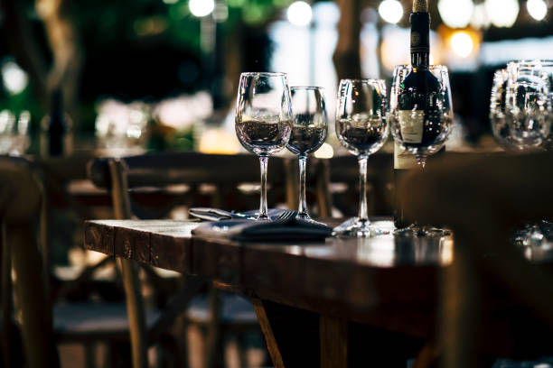istock Luxury table settings for fine dining with and glassware, beautiful blurred  background. Preparation for holiday  Christmas and Hannukah dinner night. 860090306