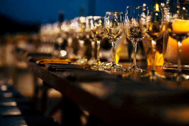 istock Luxury table settings for fine dining with and glassware, beautiful blurred  background. Preparation for holiday  Christmas and Hannukah dinner night. 860090344