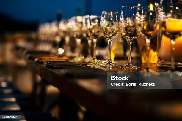 Luxury Table Settings For Fine Dining With And Glassware Beautiful Blurred Background Preparation For Holiday Christmas And Hannukah Dinner Night Stock Photo - Download Image Now