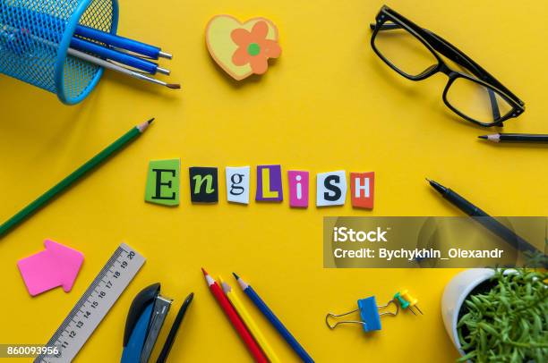 English Word Of Carved Letters On Yellow Background With Office Or School Suppliesenglish Language Learning Concept Stock Photo - Download Image Now