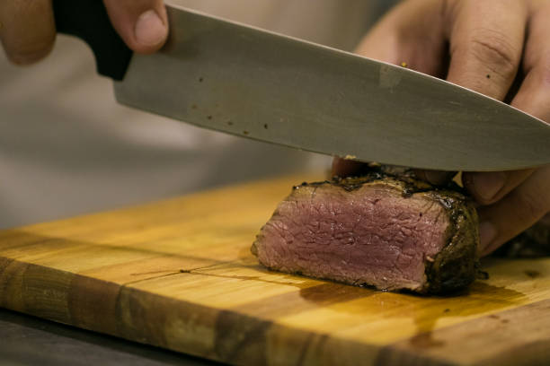 istock Gourmet chef slicing beef and preparing a stunning beef dish 860094172