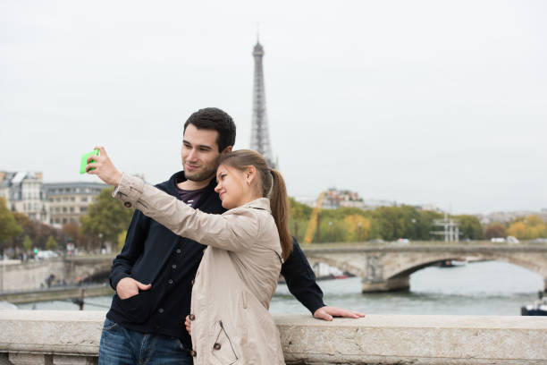 istock young couple in Paris making selfie 860097080