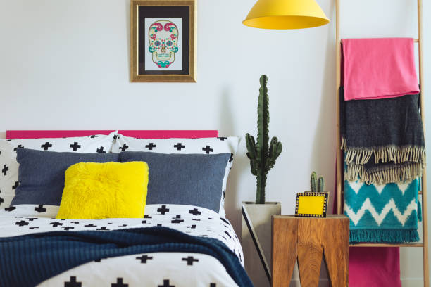 istock Folk bedroom with colorful blankets 860097450