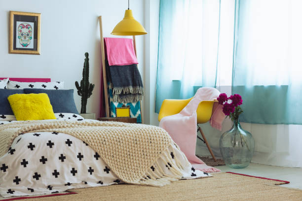 istock Violet flowers in mexican bedroom 860097452