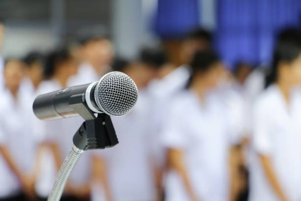 istock microphone wireless on stand Close up in conference room :Select focus with shallow depth of field. 860106360