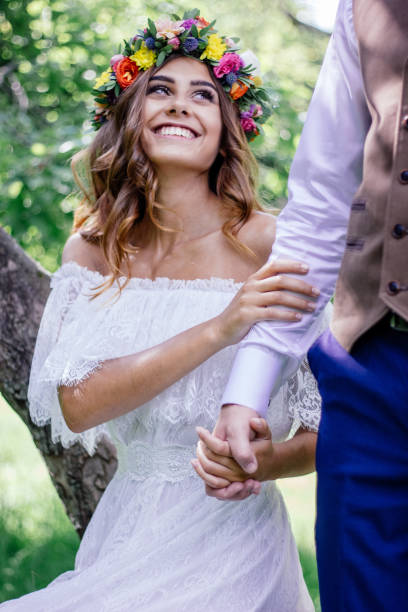 istock Bride in wedding dress near the big tree 860109122