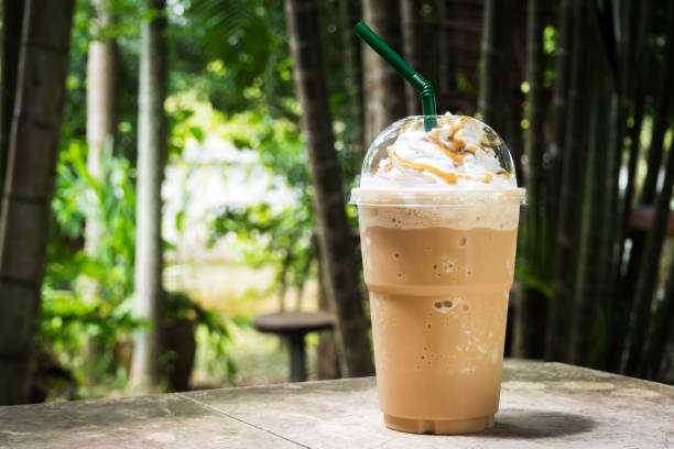 istock Coffee blend in plastic cup. Served with whipped cream topping and sweet syrup. 860112322