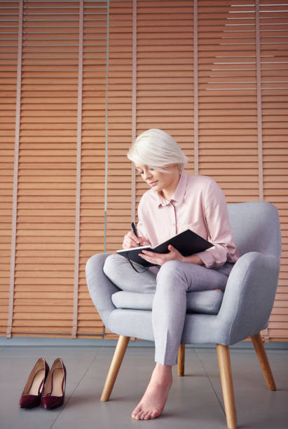 istock Barefoot preparing business plan at home office 860116660