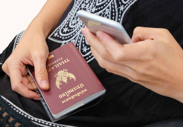 istock A lady holding Thailand passport. 860116696