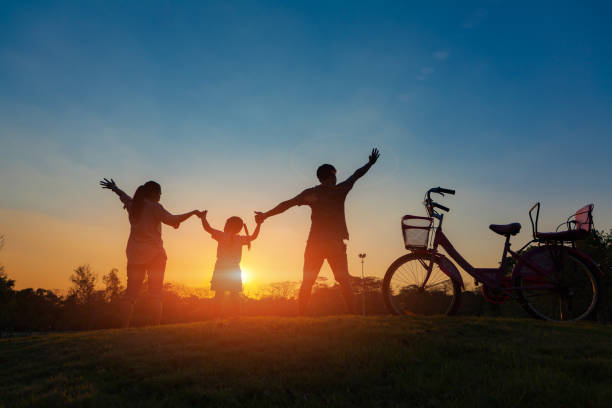 istock Family silhouette with bike, 860120202