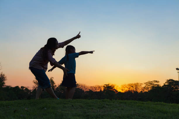 istock Silhouette healthy and daughter playing together. 860120412