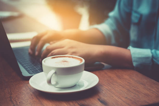 istock Hands typing on laptop in coffee shop 860120752